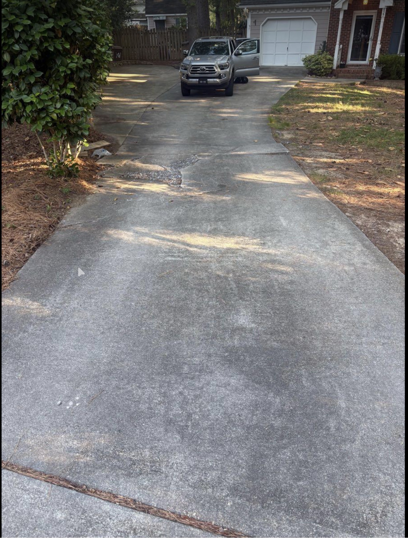 Stained concrete driveway before cleaning