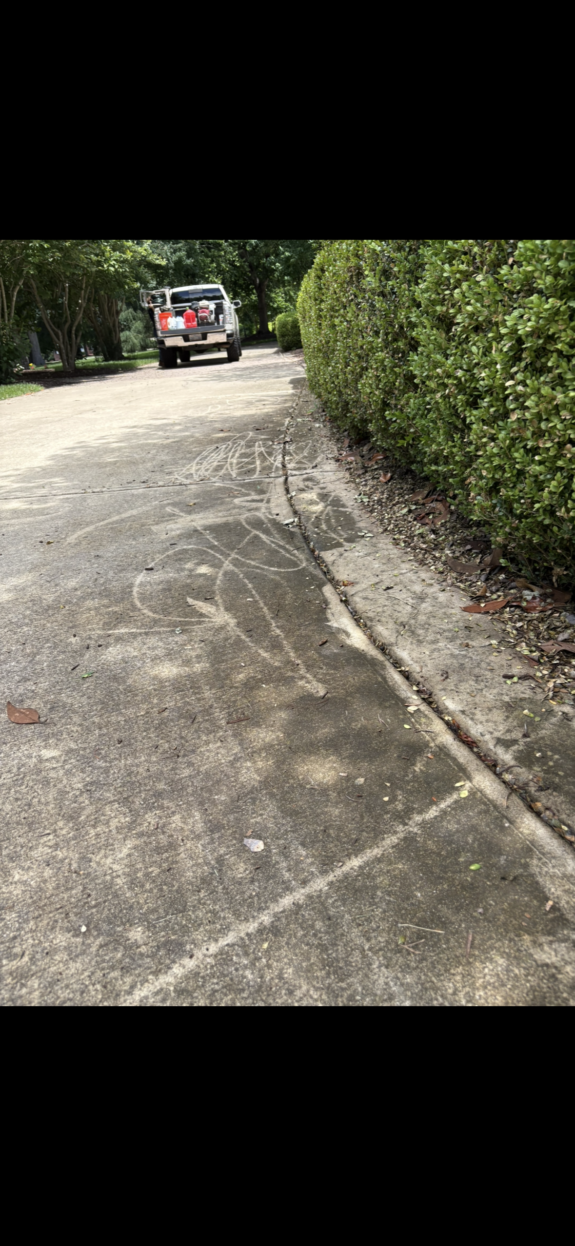 Dirty concrete driveway before restoration in Wake Forest NC