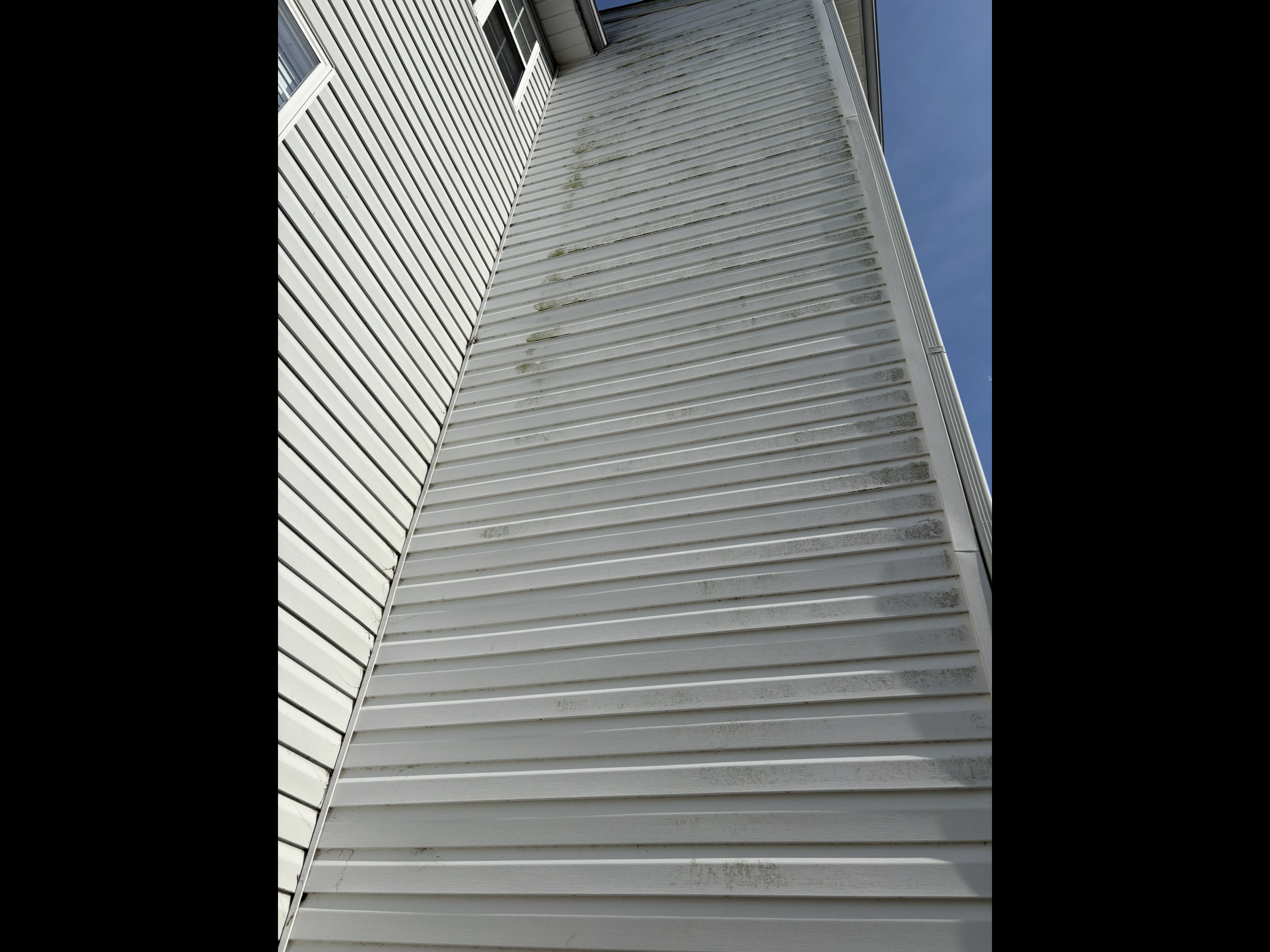 Home exterior before professional soft washing
